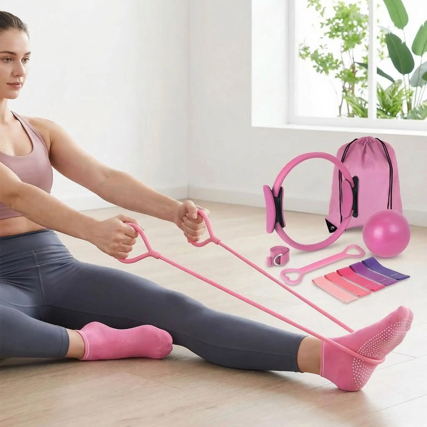 Fille avec kit pilates rose 13 pièces